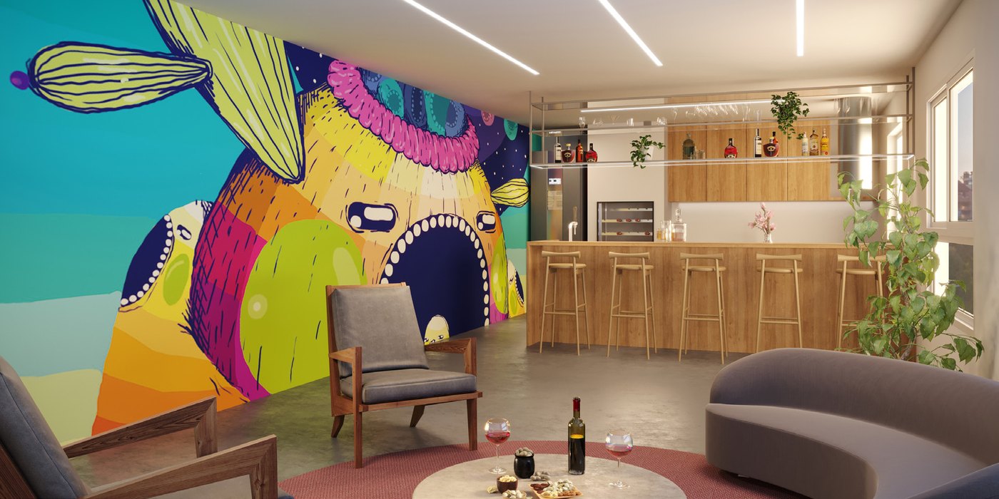 Salão de festas do RISE, com bancada e painel grafitado